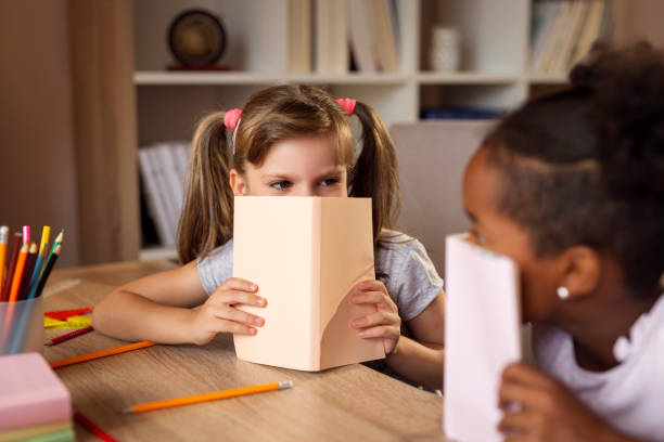 istock Girls reading books 1008016694