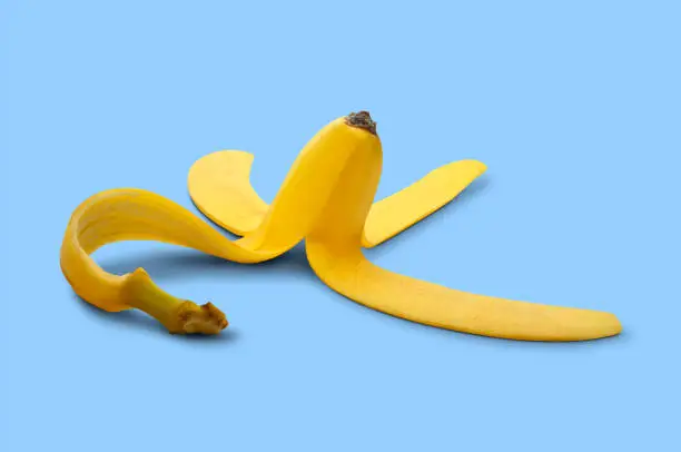 Photo of Banana Peel On Blue Background