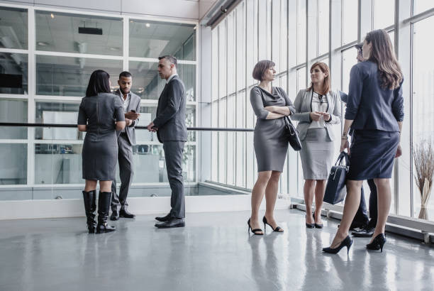 istock Business People Discussing in The Hallway 1008019434