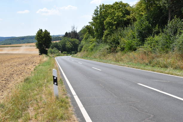 istock lonely country road in late summer 1008019454