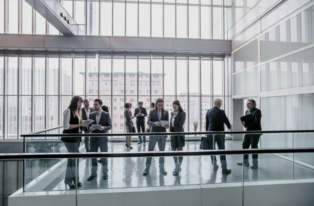 istock Business People Discussing in The Hallway 1008019458