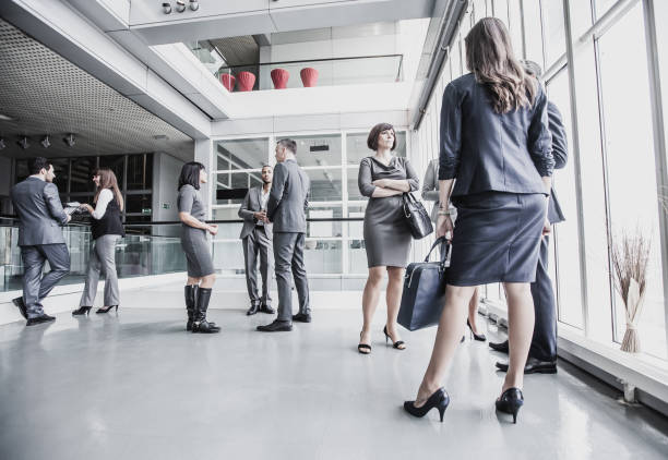 istock Business People Discussing in The Hallway 1008019468