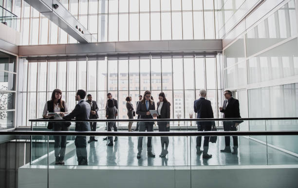 istock Business People Discussing in The Hallway 1008019482