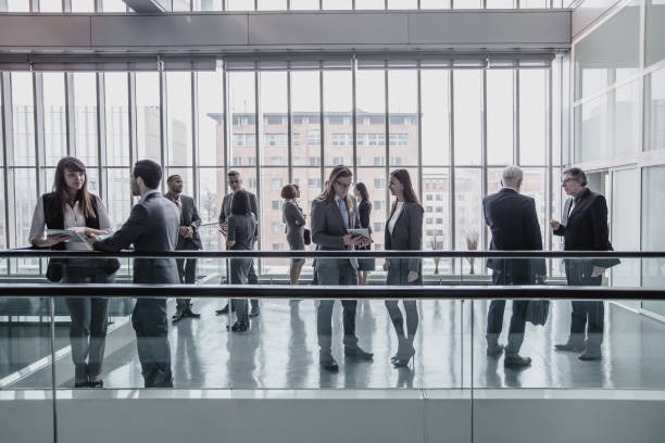 istock Business People Discussing in The Hallway 1008019500