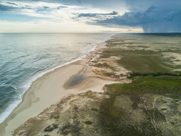 Uruguayan beaches are incredible, wild and virgin beaches wait for the one that wants to go to this amazing place where enjoy a wild and lonely beach. Here we can see an aerial view over Cabo Polonio Cabo Polonio at North West Uruguay is an awesome place to enjoy wild beaches and rural areas, just relax and take a walk along miles and miles of sandy beaches cabo polonio photos stock pictures, royalty-free photos & images