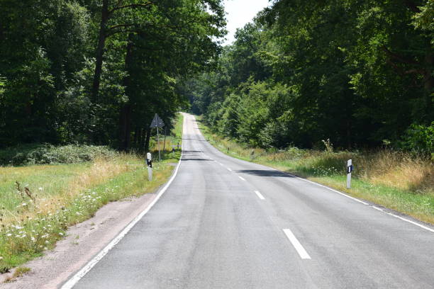 istock lonely country road in late summer 1008025318