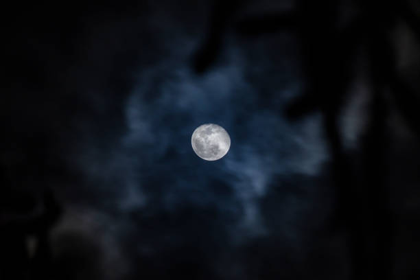 Full moon on cloudy day stock photo