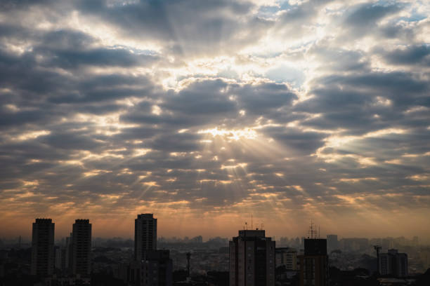 Early morning in São Paulo with lots of clouds and rays of sunshine stock photo