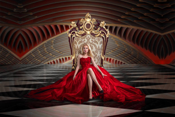 Stunning woman A woman in a luxurious gown dress sitting on a queen's throne queen royal person stock pictures, royalty-free photos & images