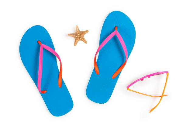istock Blue Flip Flops and Pink Sunglasses Isolated on White Background. Top view 1008052480