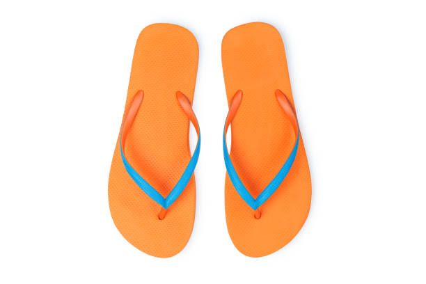istock Orange Flip Flops Isolated On White Background. Top View 1008065102