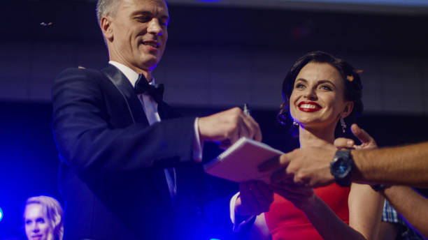 istock Famous couple giving autographs 1008068290