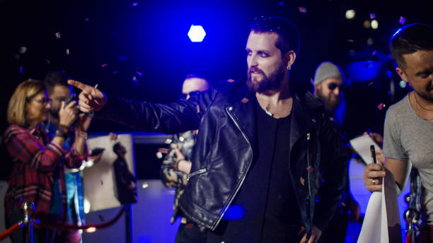 istock Rock musician gesturing for photographers 1008070540