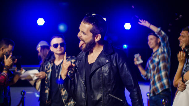 istock Rock musician gesturing for photographers 1008070570