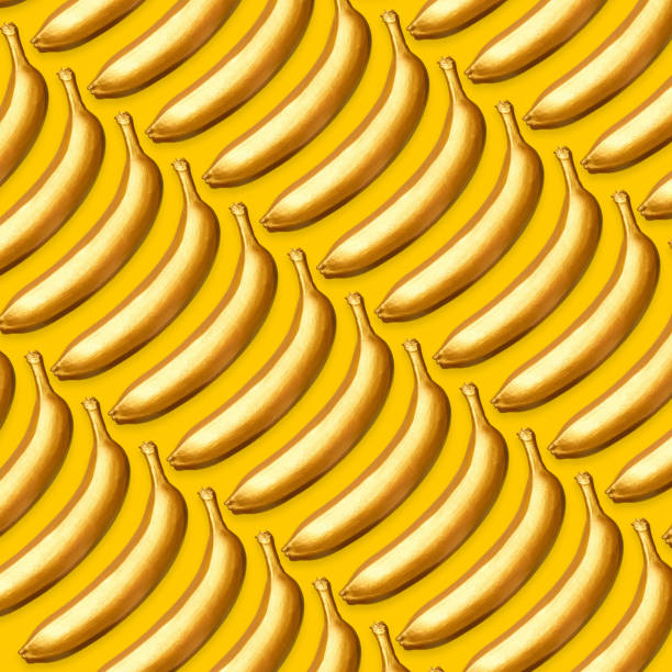 istock Pattern of golden bananas on a yellow background 1008080618