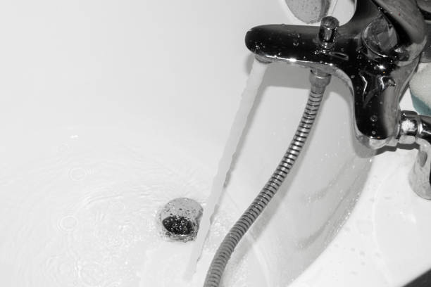 istock The hot water flows into the tub. 1008090694