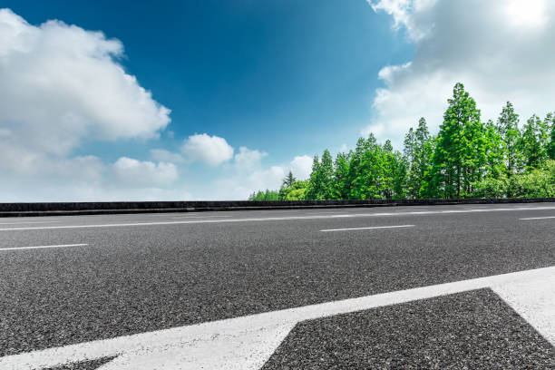 istock Asphalt road and green forest landscape under the blue sky 1008101768