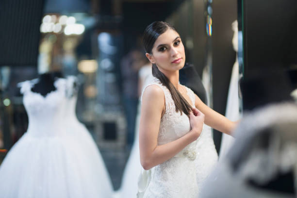 istock Charming bride posing in a wedding dress 1008104728