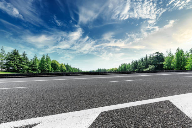 istock Asphalt road and green forest landscape under the blue sky 1008104730