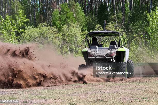 A Sidebyside Ripping Up Dirt As It Turns A Corner Stock Photo - Download Image Now