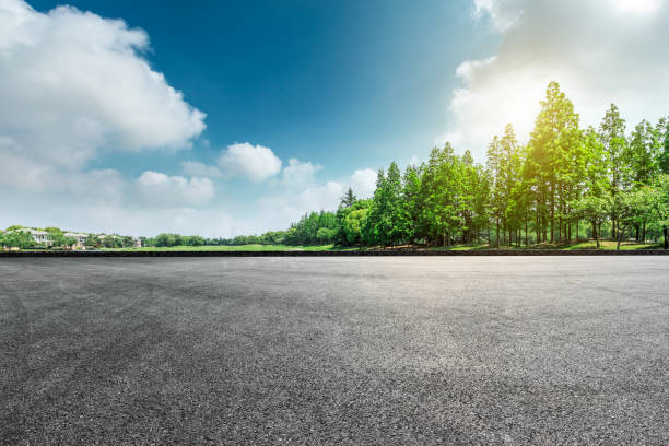 istock Asphalt road and green forest landscape 1008107564
