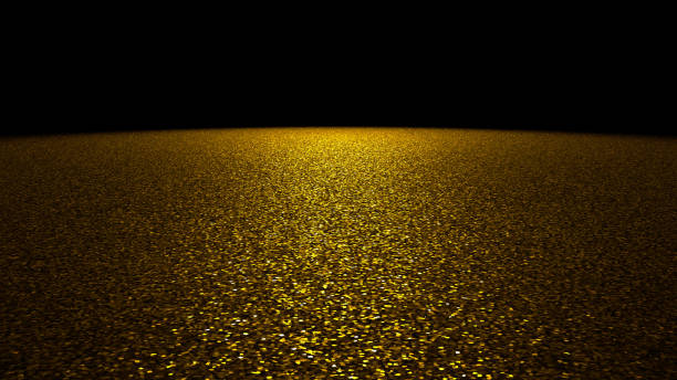 istock glitter background - sparkling golden glitter on a stage lit by a big bright spotlight in front of a black background 1008107584