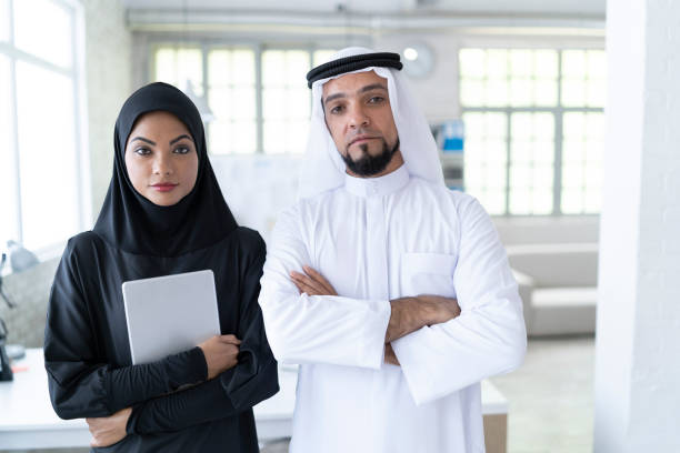 istock Arab businesspeople standing arms crossed 1008107588
