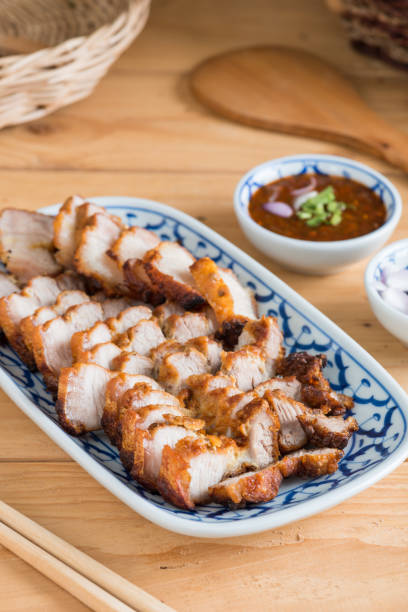 istock Deep Fried Crispy Pork Belly Cooked with Garlic and spicy dipping sauce 1008107666