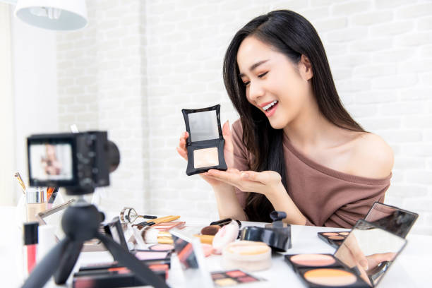 istock Beautiful Asian woman professional beauty vlogger recording makeup tutorial 1008108180