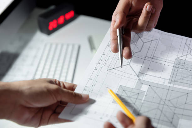 istock Architect team discussing blueprint paper in office 1008108372