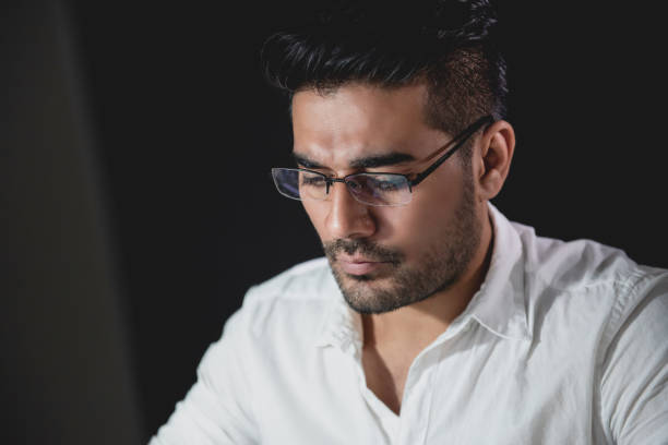 istock Asian businessman concentrating on working at night 1008108474