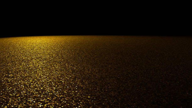 fondo de glitter - brillo oro chispeante en un escenario iluminado por un foco luminoso grande de la izquierda delante de un fondo negro - spot lit fotografías e imágenes de stock