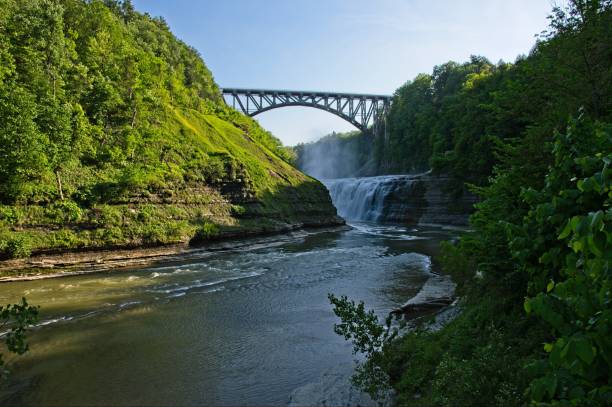 The Genesee river flows through a deep gorge at Letchworth state park in western New York Waterfalls and rugged terrain can be found in this western New York state park. letchworth state park stock pictures, royalty-free photos & images