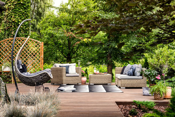 istock Hanging chair on wooden patio 1008118464