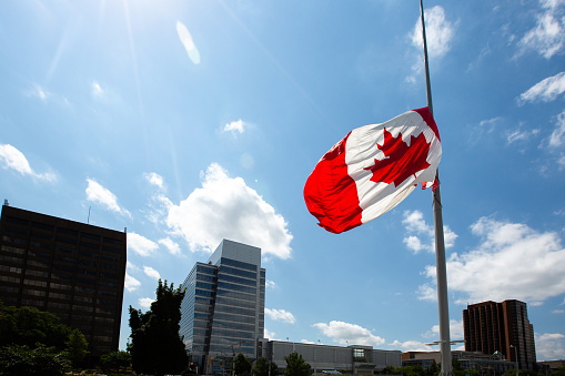 The Canadian Flag flying at half mast in Windsor, Ontario, Canada.