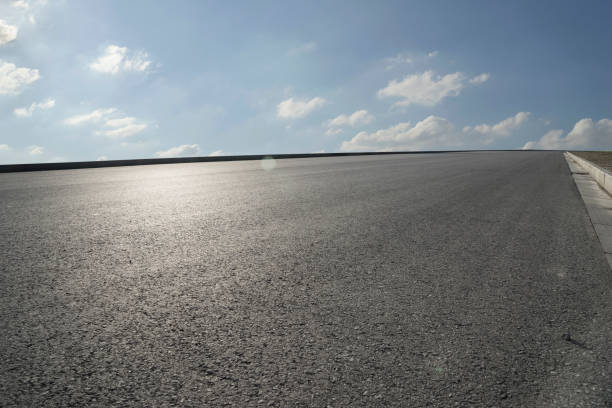 istock Asphalt road and  beautiful urban skyline 1008135618