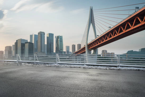 istock empty road with cityscape in modern city 1008137840