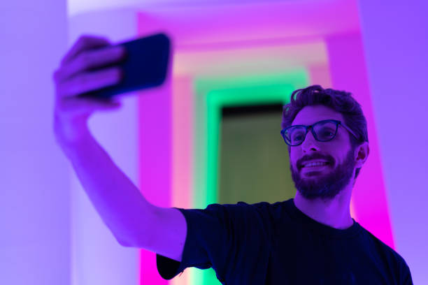 istock Self Portrait of a Handsome Man at Colored Tunnel 1008161356