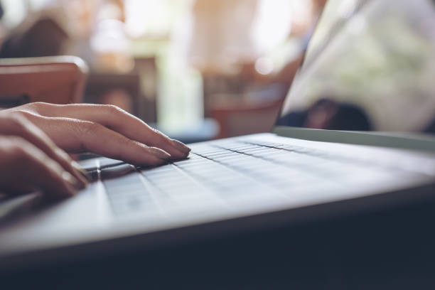 istock Closeup image of a woman's hands using and typing on laptop keyboard 1008161490