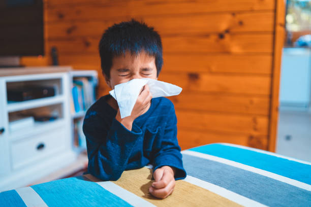 Kid Blowing Nose with Tissue. Kid Blowing Nose with Tissue. h1n1 flu virus stock pictures, royalty-free photos & images