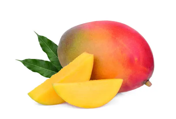 Photo of whole and slice ripe mango fruit with green leaves isolated on white background