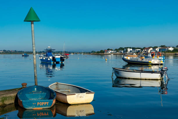 MudefordChristchurchDorsetEnglandJuly 23, 2018Boats moored in the natural harbour at Mudeford Quay