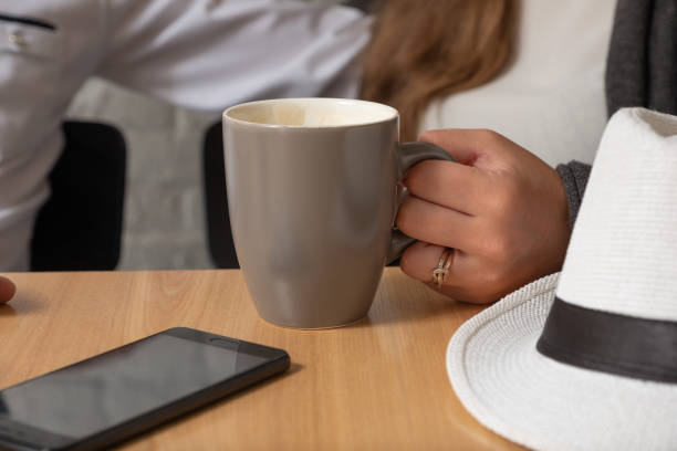 istock The female hand holds a cup of tea. 1008202336