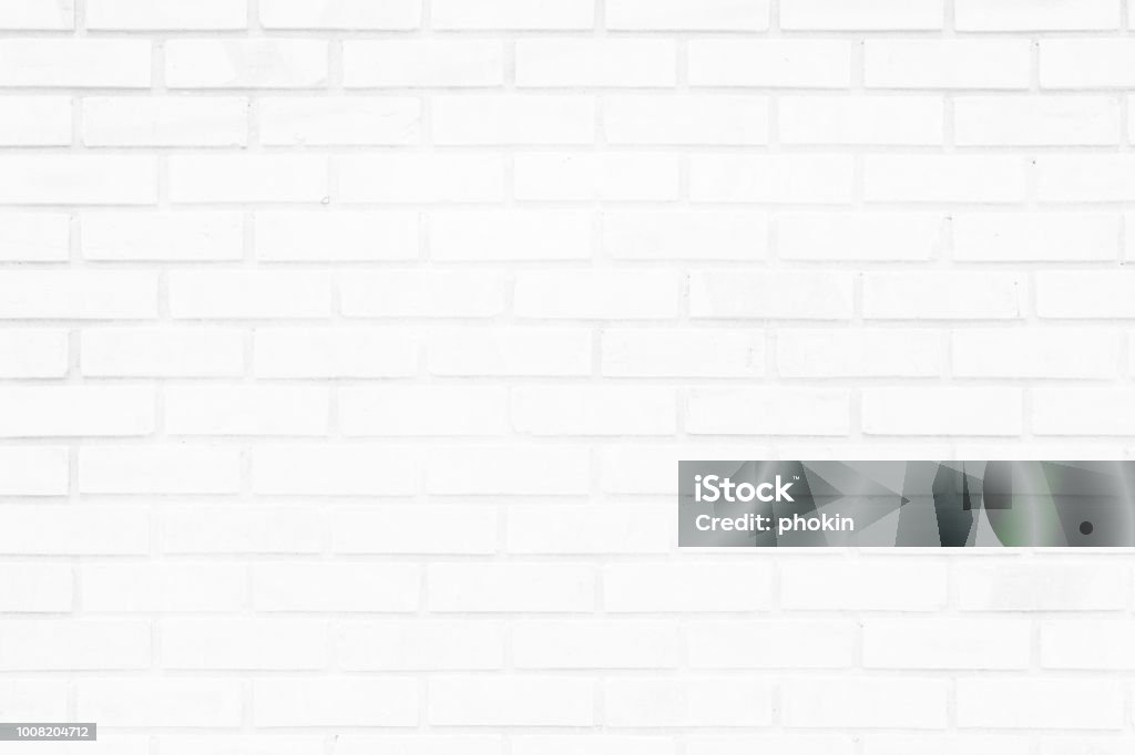 White brick wall texture background. Brickwork or stonework flooring interior rock old pattern clean concrete grid uneven bricks design stack. White Color Stock Photo