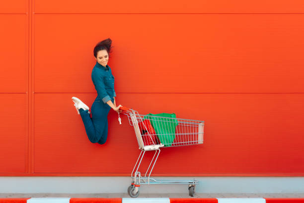 istock Happy Woman with Shopping Jumping with Joy 1008207168