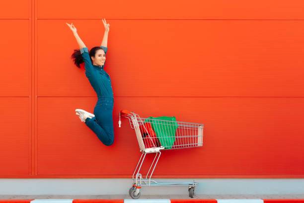 istock Happy Woman with Shopping Jumping with Joy 1008207178