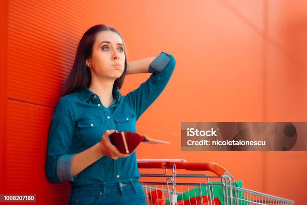 Unhappy Female Customer Having No More Money To Spend Stock Photo - Download Image Now