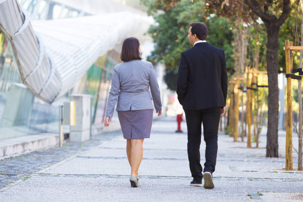 istock Confident business colleagues in formal suits going to office 1008209844