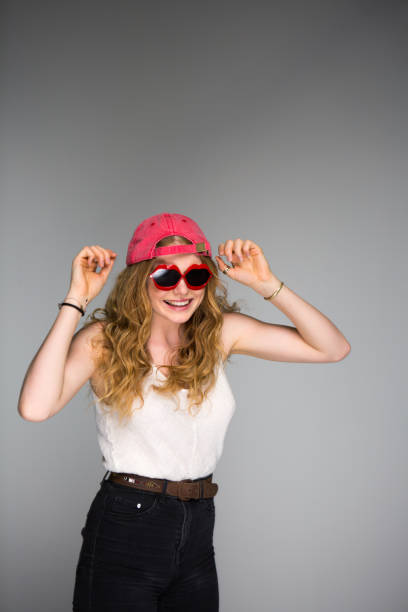 istock Funky young hip woman wearing baseball cap 1008210028