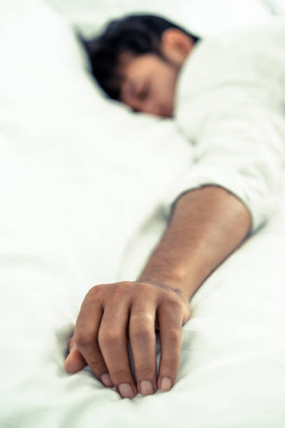 istock Young man sleep in bed in the bedroom. 1008215346